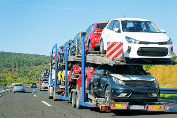 Affordable Tennessee Auto Transport Services 1 truck transporting cars on a highway