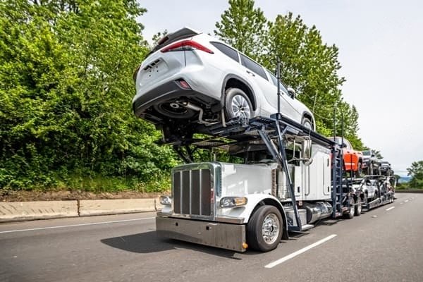 Reliable Bordentown Auto Transport services 2 Auto transport services carrier loaded with SUVs and trucks
